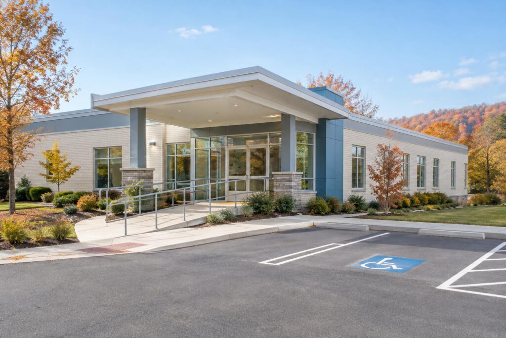 Single-story clinic building with a covered entrance and accessible ramp
